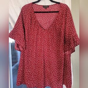 Fun and flirty spring blouse! Looks great with jeans, slacks, and skirts!